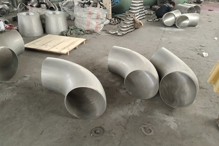 Pipe elbows showing curved profiles and weld-end openings