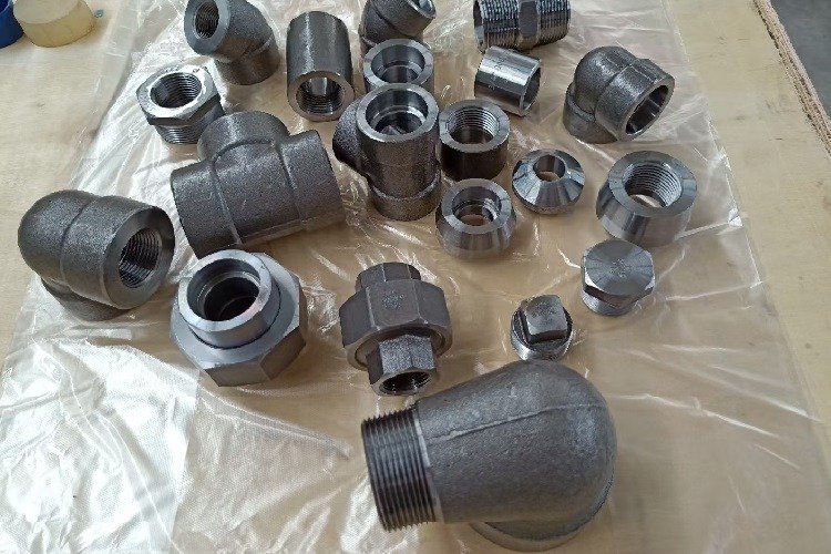 Forged fittings showing elbows, couplings, unions and plugs