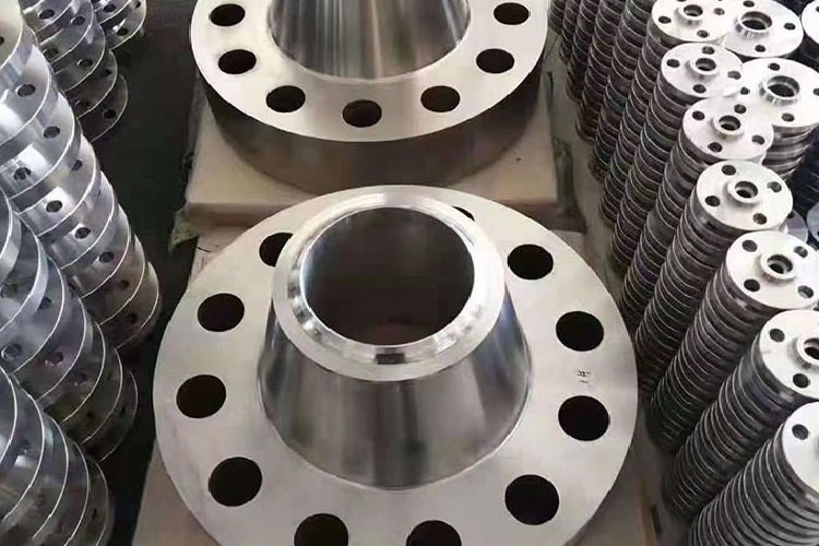 Weld neck flanges showing tapered hubs and bolt holes