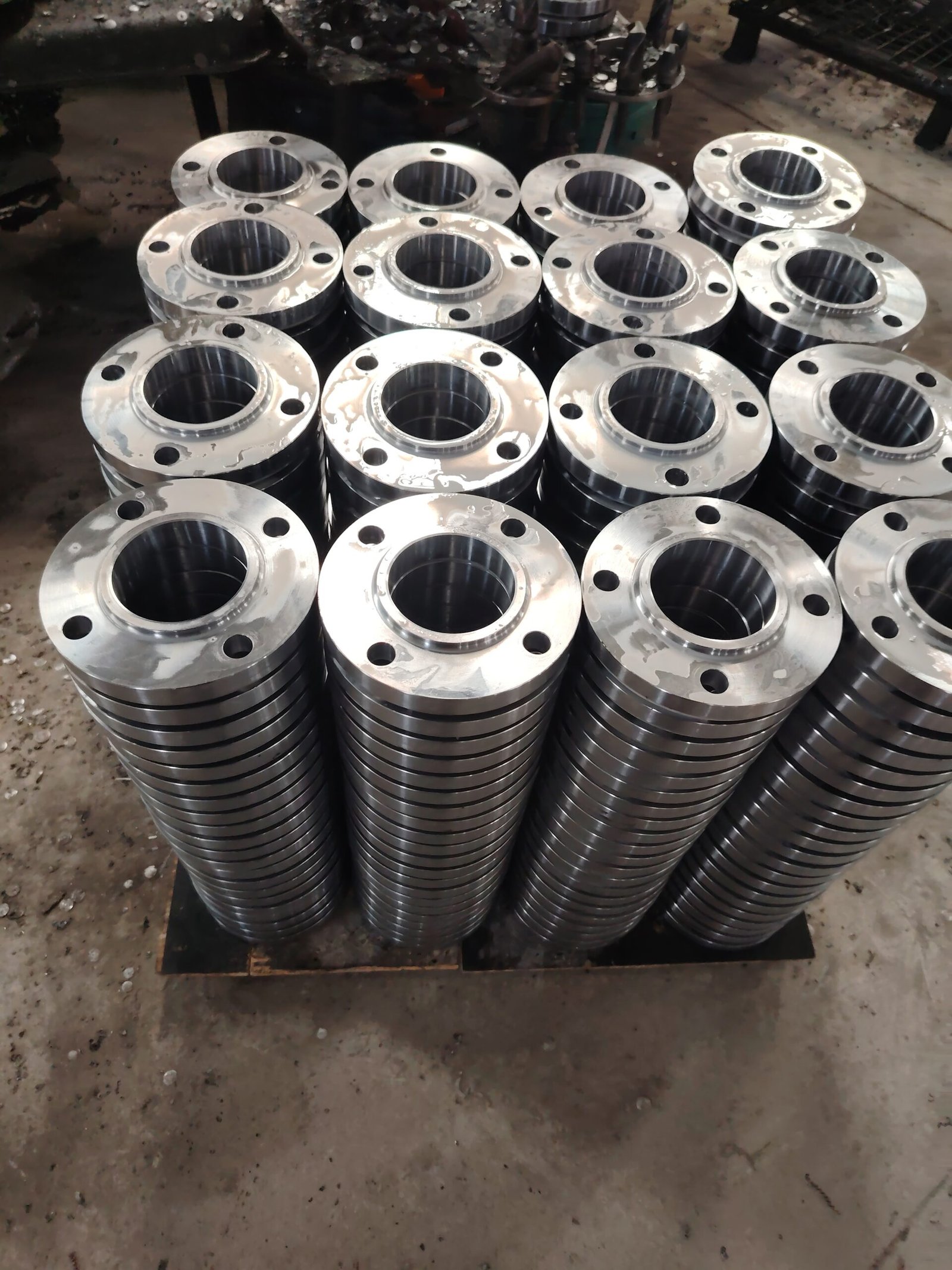 Machined flanges arranged in stacked batches
