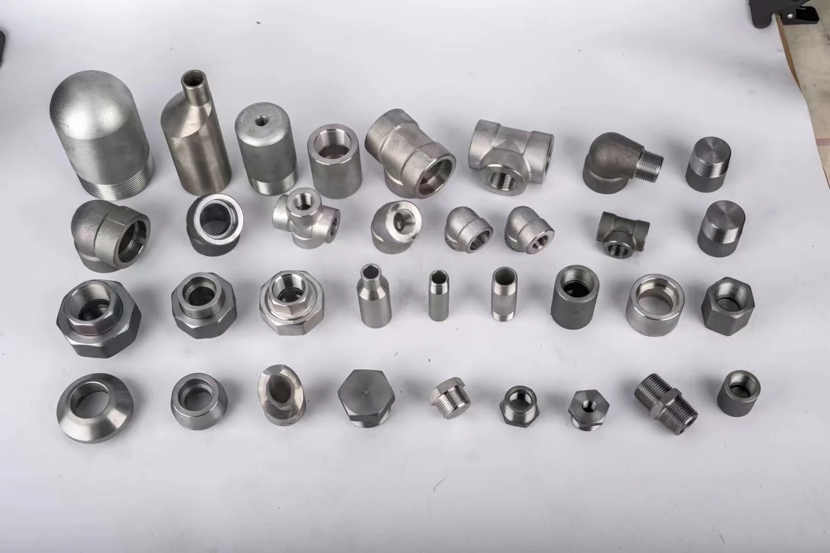 Forged fittings arranged by product shape